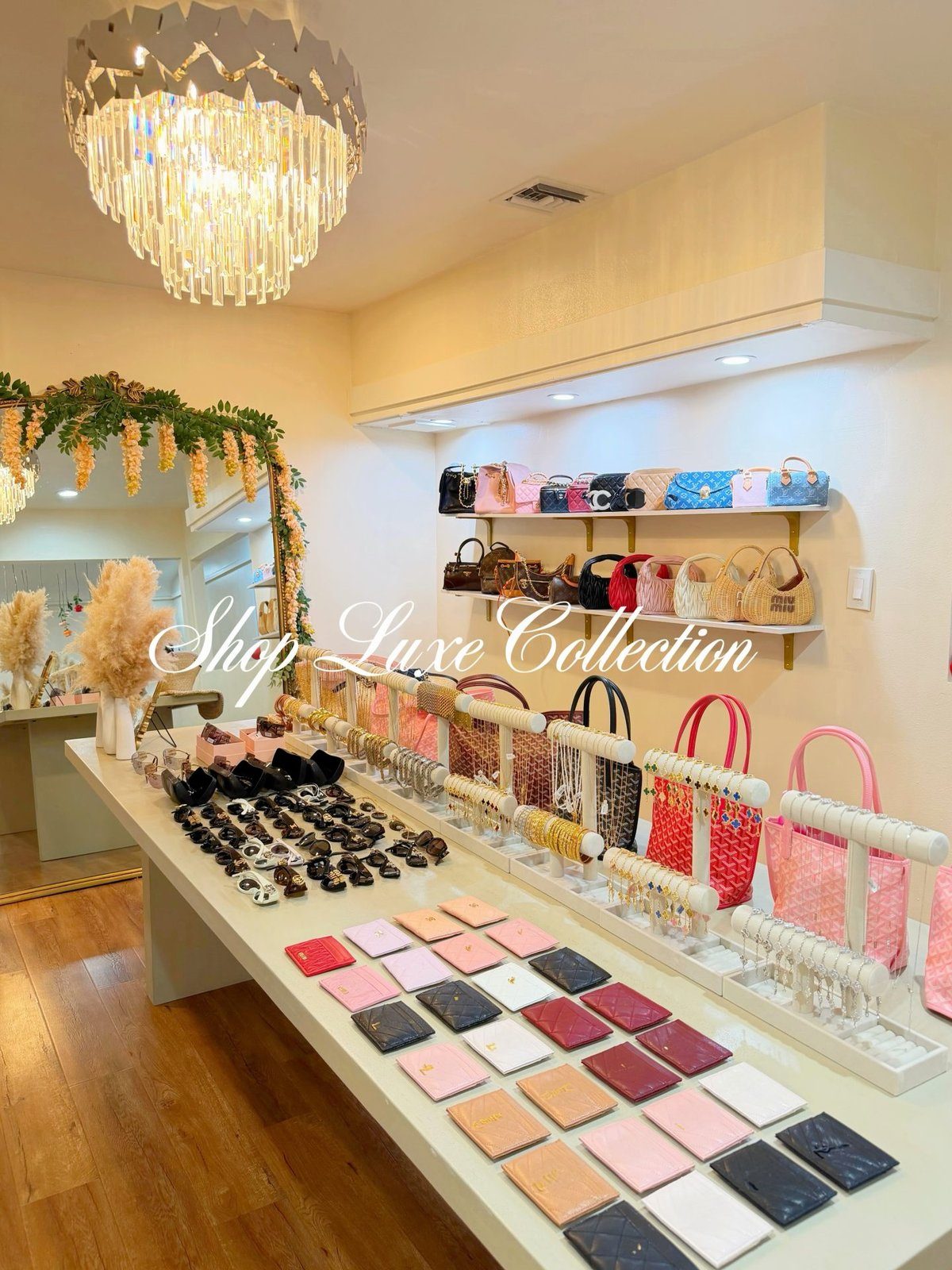 Inside the boutique: handbags on the shelves, jewelry on the display table
